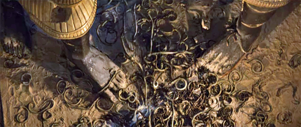 Scene from Indiana Jones and the Raiders of the Lost Ark where the floor is covered in snakes. Snakes in a dream meaning.